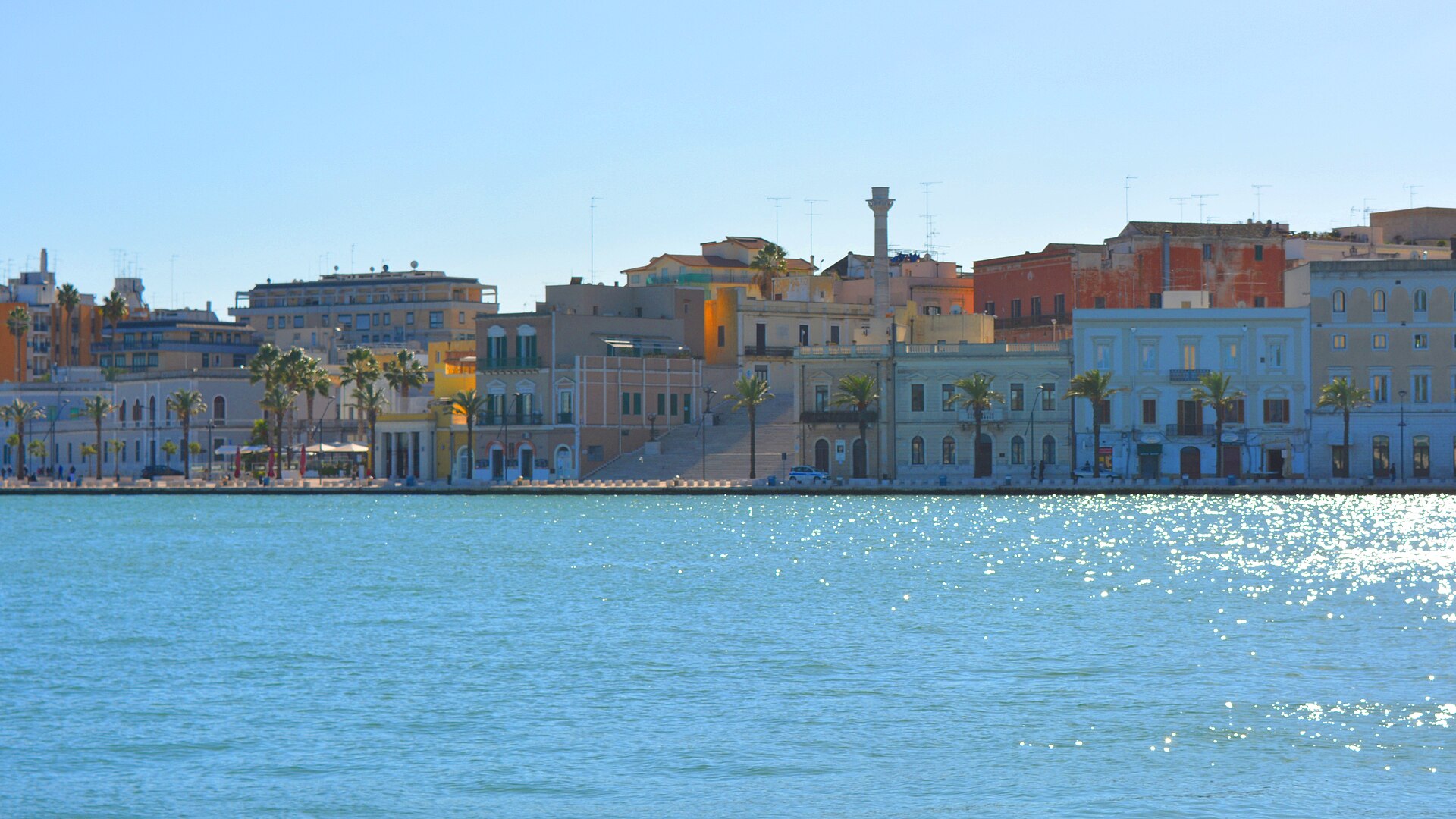 Colorful buildings along Lungomare Regina Margherita across Brindisi harbor