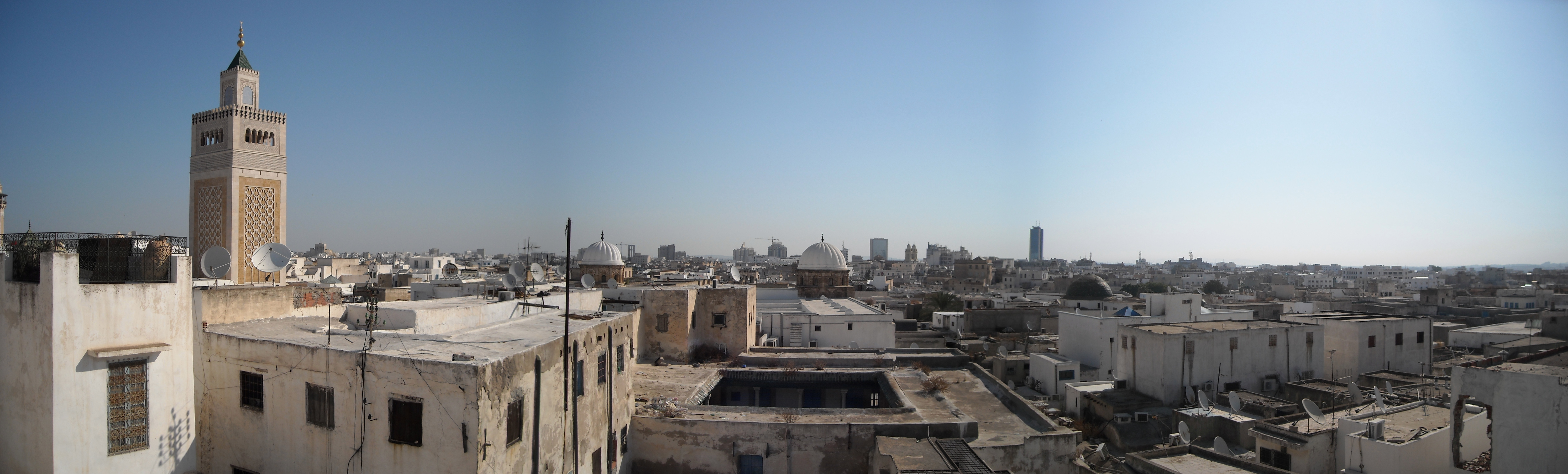 Panoramic view across the Medina of Tunis with minarets and the modern skyline beyond