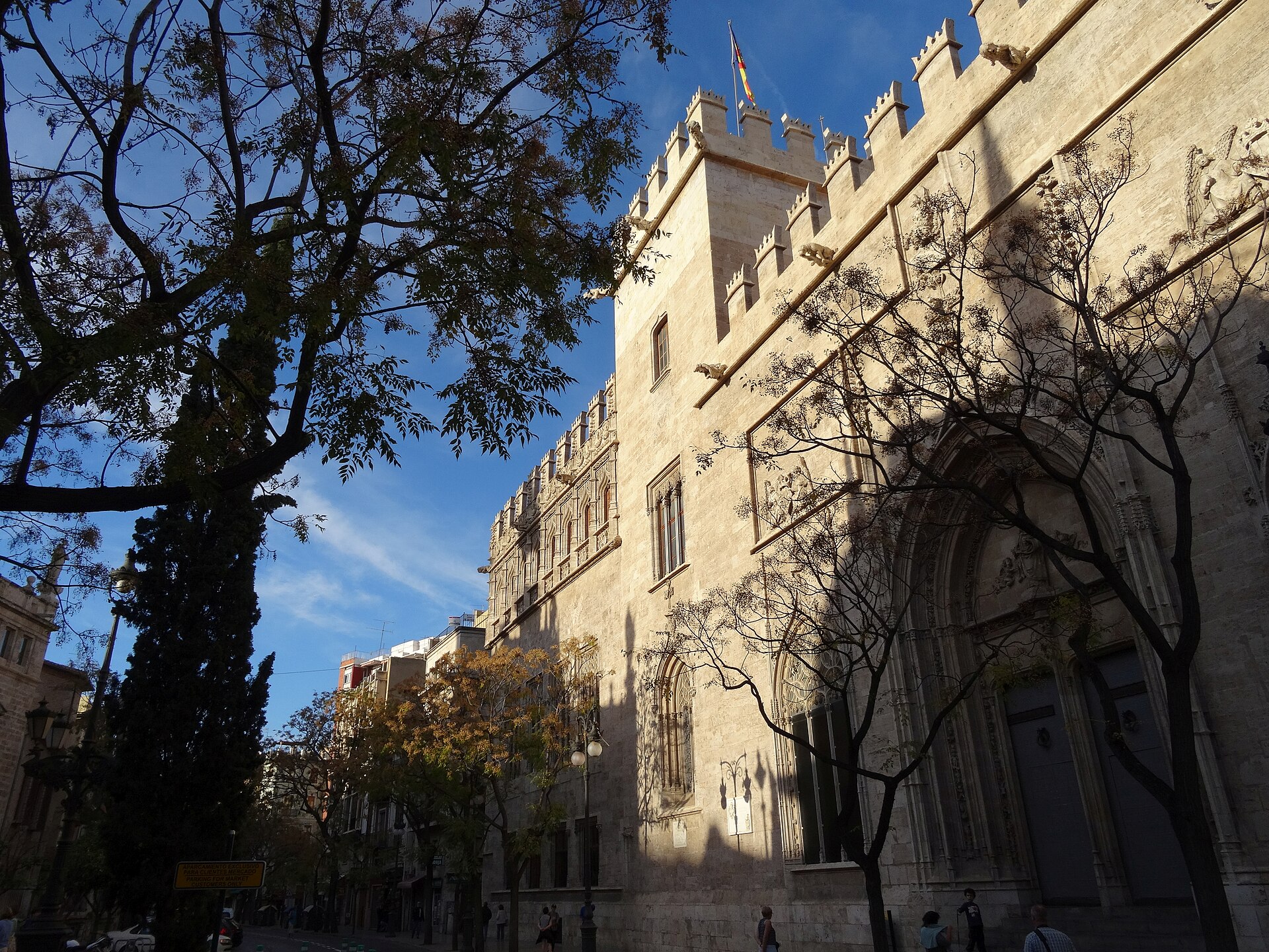 Late Gothic exterior of Valencia's Lonja de la Seda beneath a blue sky