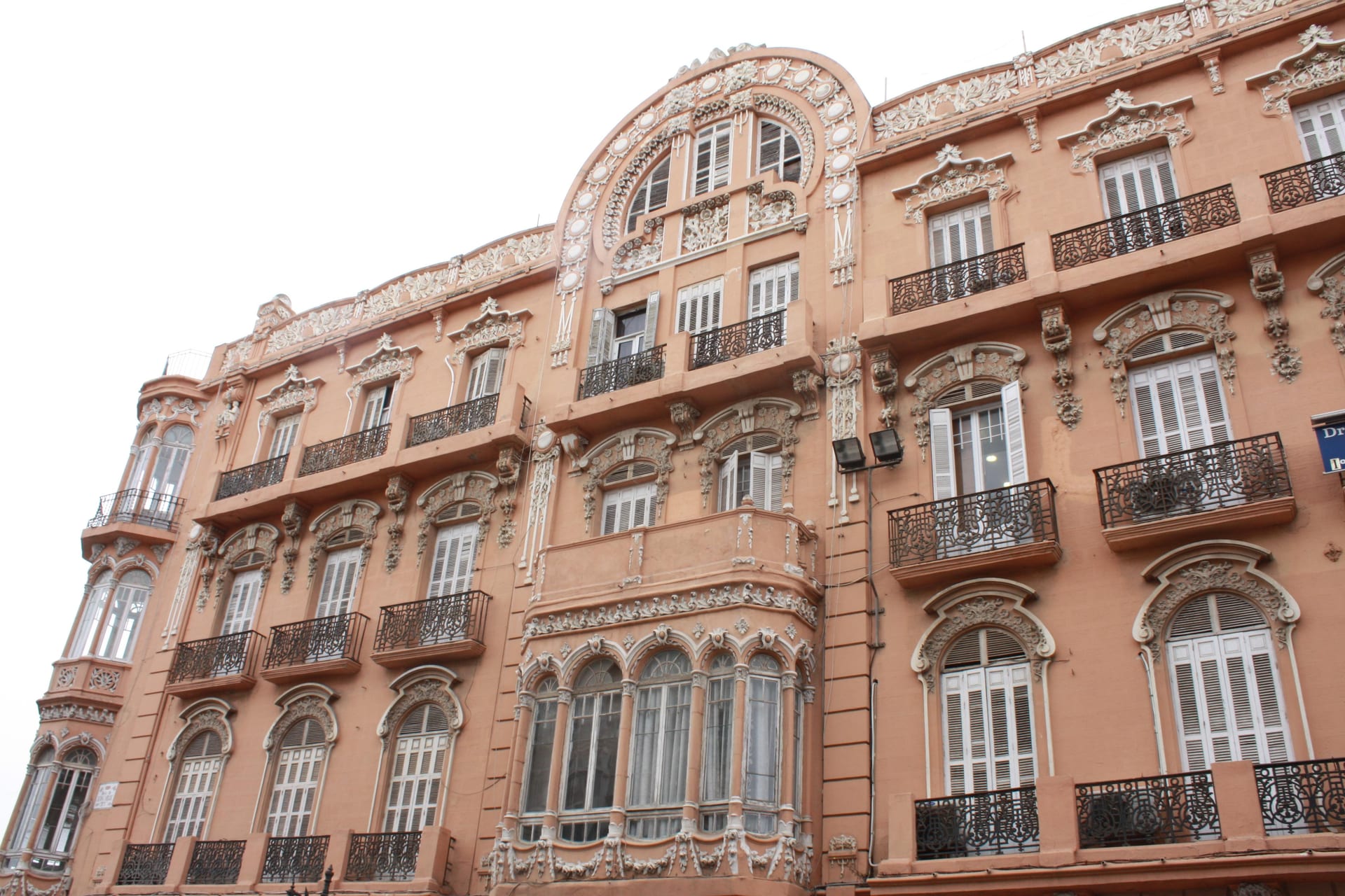 Ornate modernist façade, curved windows and iron balconies of Casa Melul in central Melilla