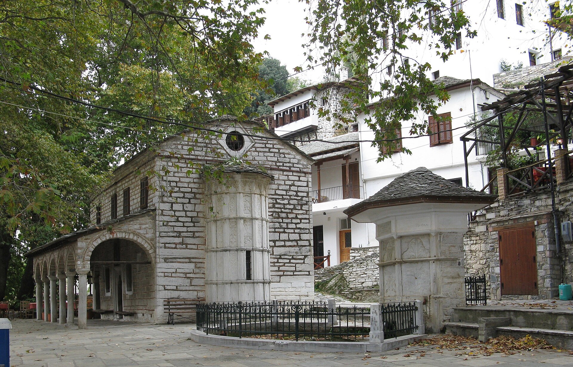 Stone church, fountain and traditional houses in Makrinitsa village on Mount Pelion