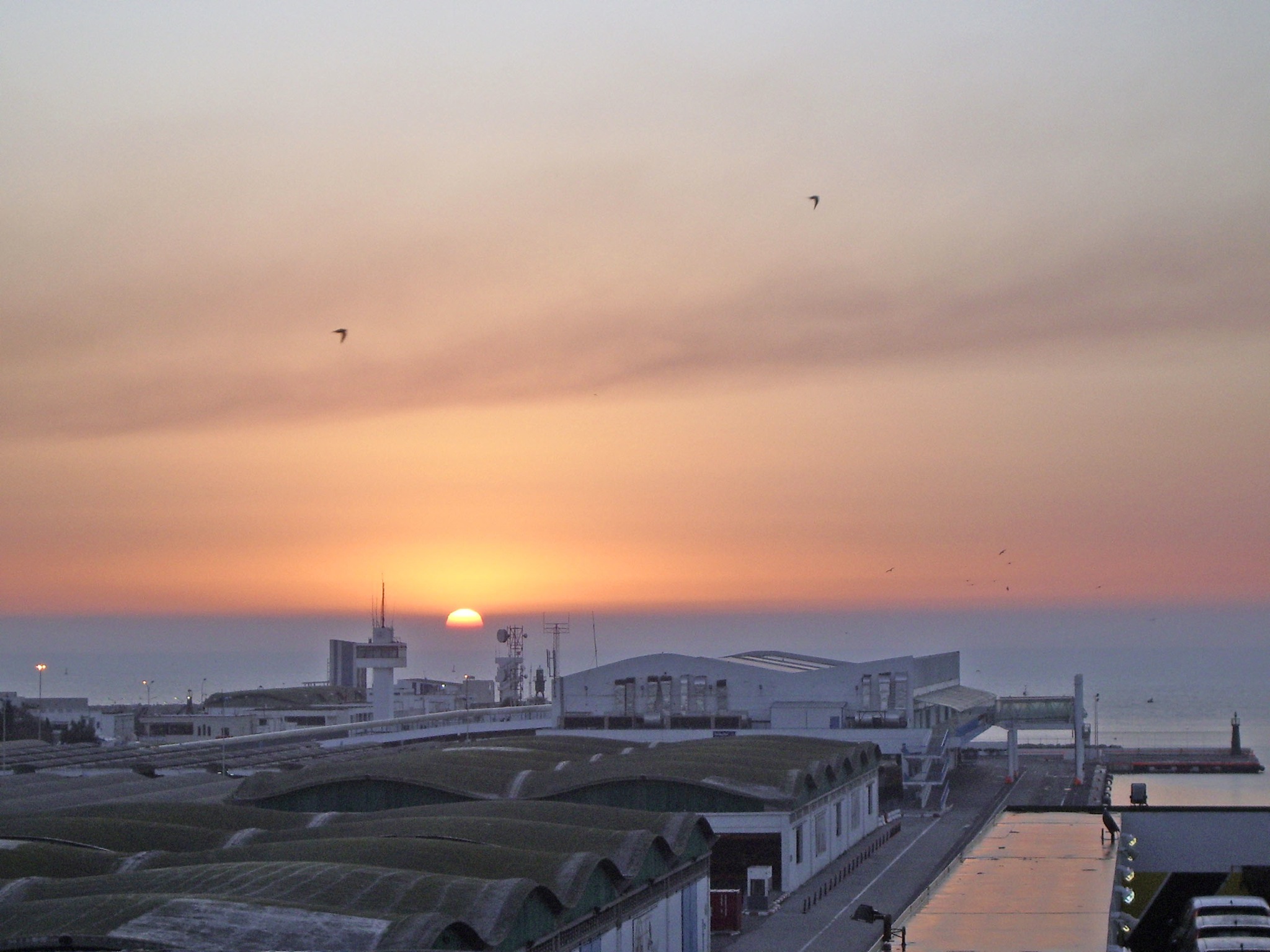 Sunrise over the passenger port and harbor buildings at La Goulette, Tunisia