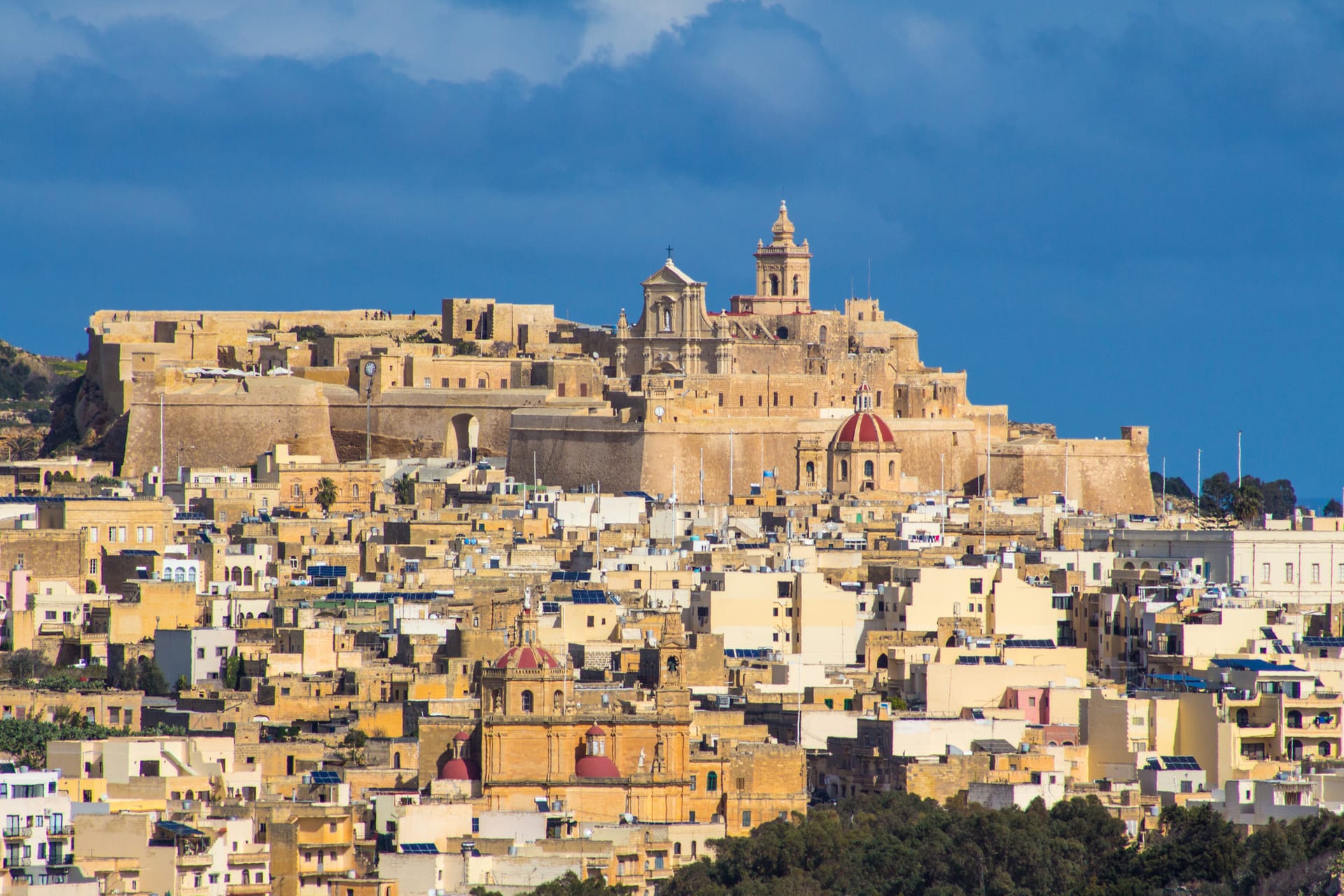The fortified Cittadella rising above the honey-colored roofs of Victoria on Gozo