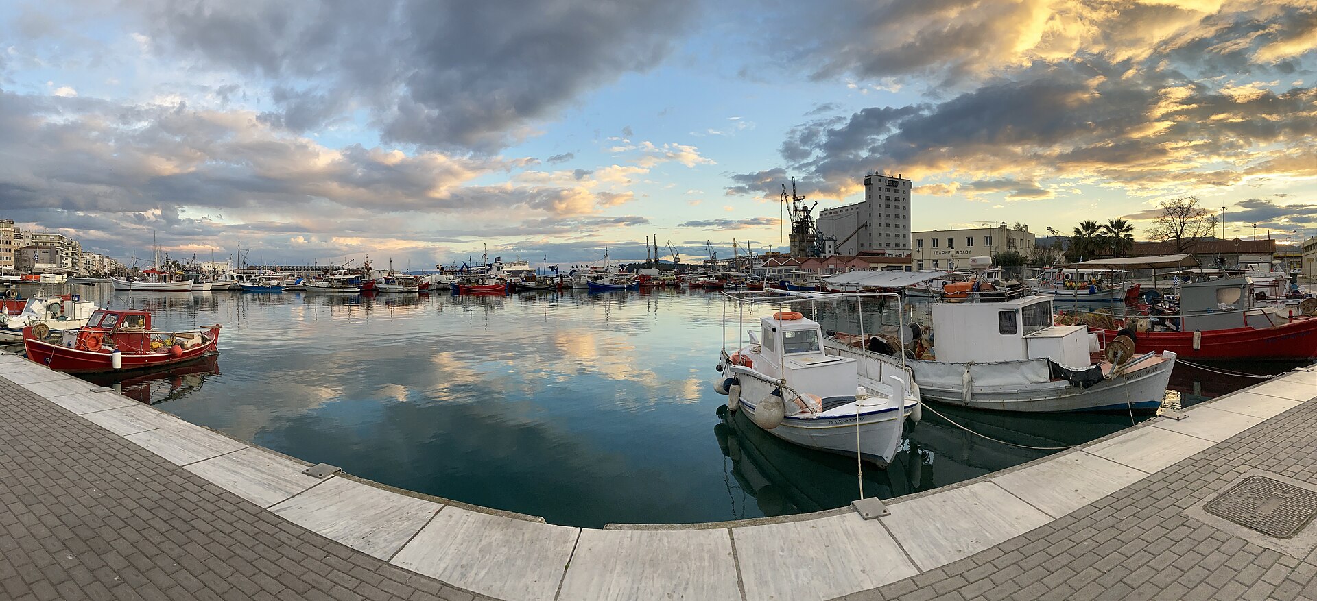 Small boats and working waterfront at the Port of Volos on the Pagasetic Gulf
