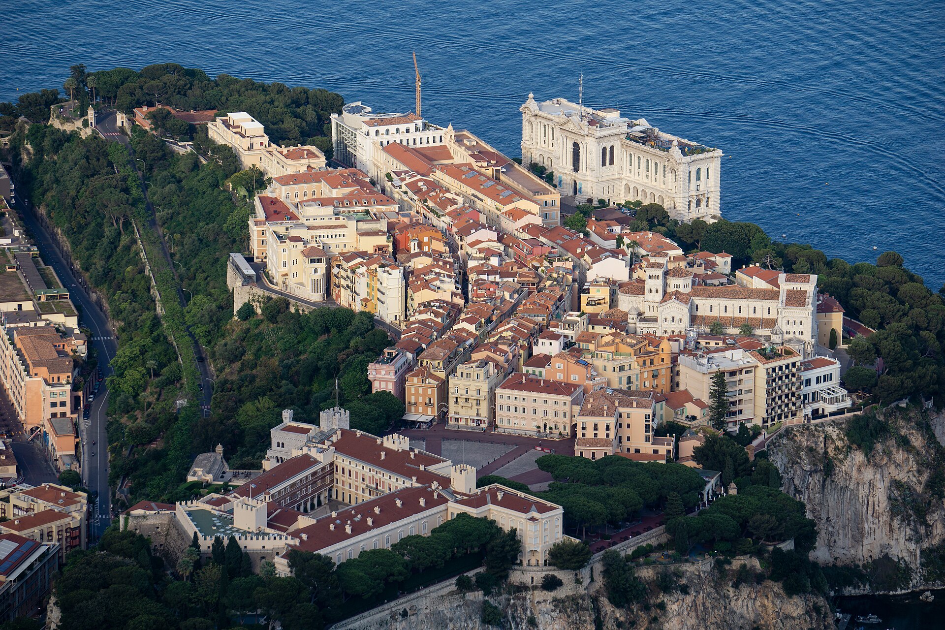 Aerial view of Monaco-Ville on the Rock with the Prince's Palace, cathedral and Oceanographic Museum above the Mediterranean