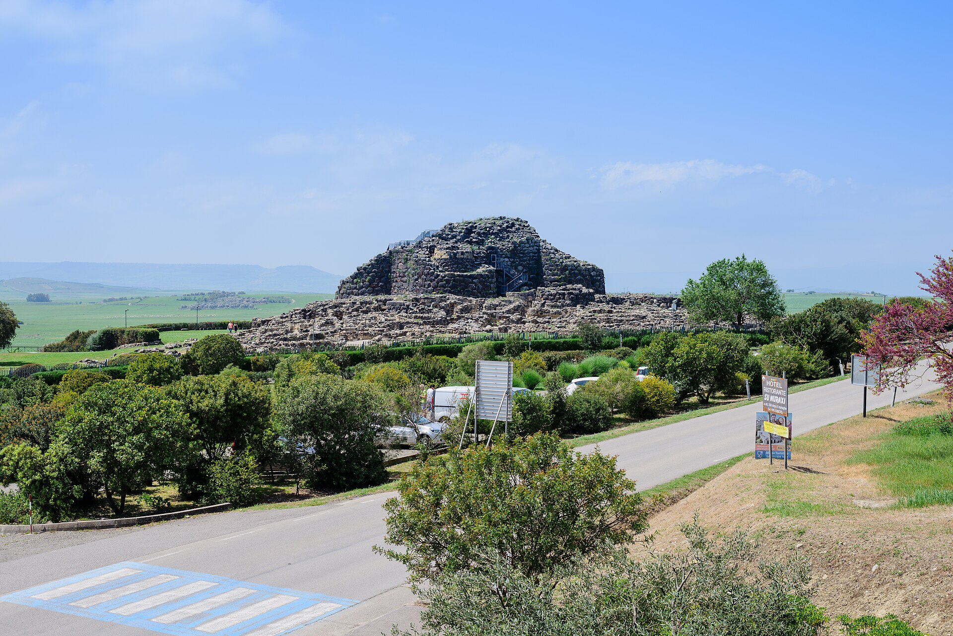 Bronze Age stone towers and settlement remains of Su Nuraxi at Barumini in Sardinia's green interior